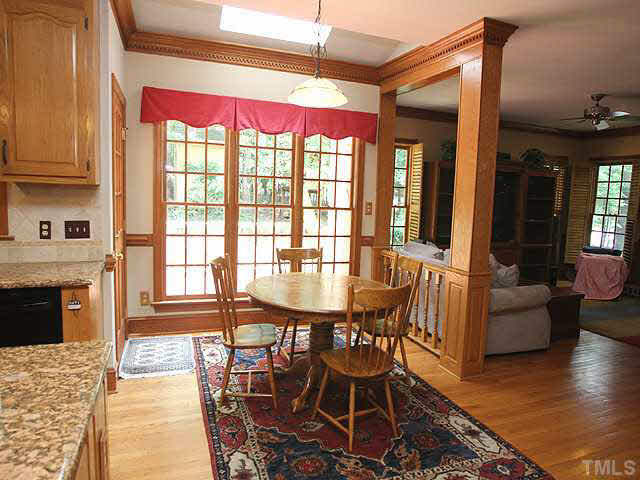 6116 Battleview Drive Raleigh, NC 27613 - Photo 5 of 13 a view of a dining room with furniture window and wooden floor