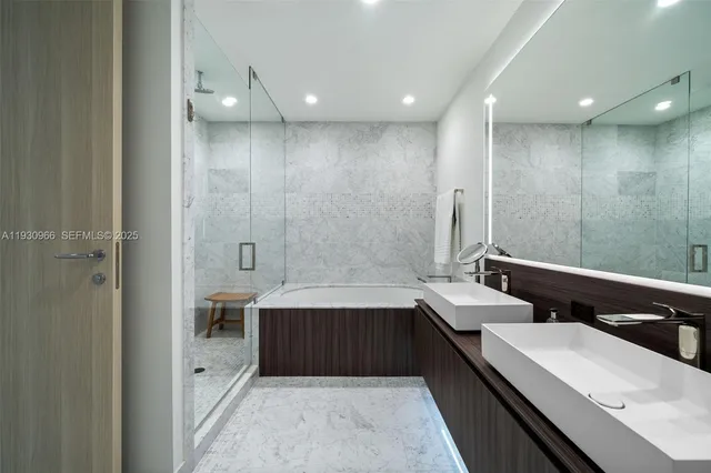 a bedroom with two beds and painting on the wall