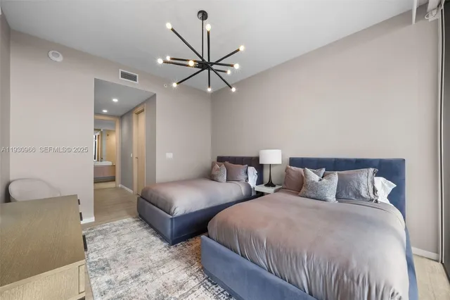 a large white bed in a hotel room