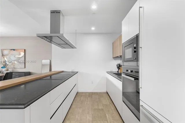 a view of a balcony with chair and city view