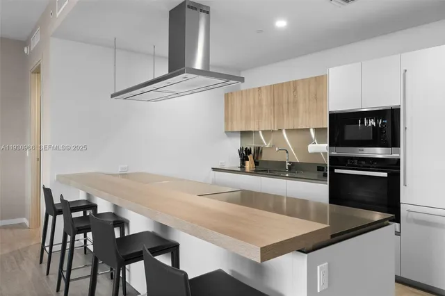 a kitchen with a table and chairs in it