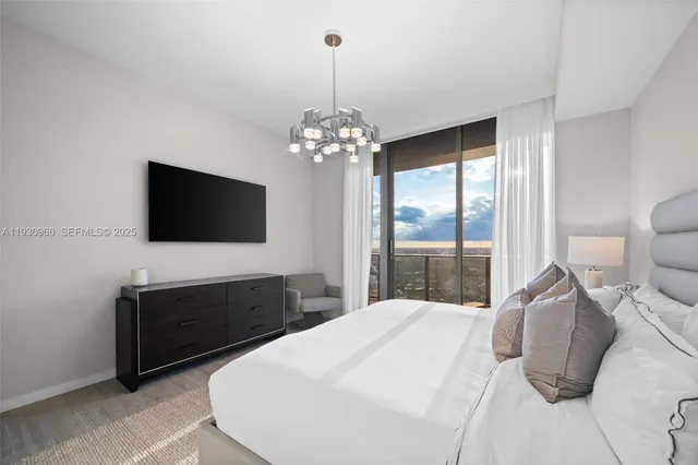 a kitchen with stainless steel appliances a sink a stove and a refrigerator