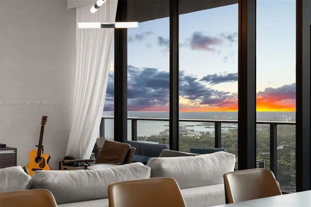 a bedroom with a bed chandelier and a view of bedroom