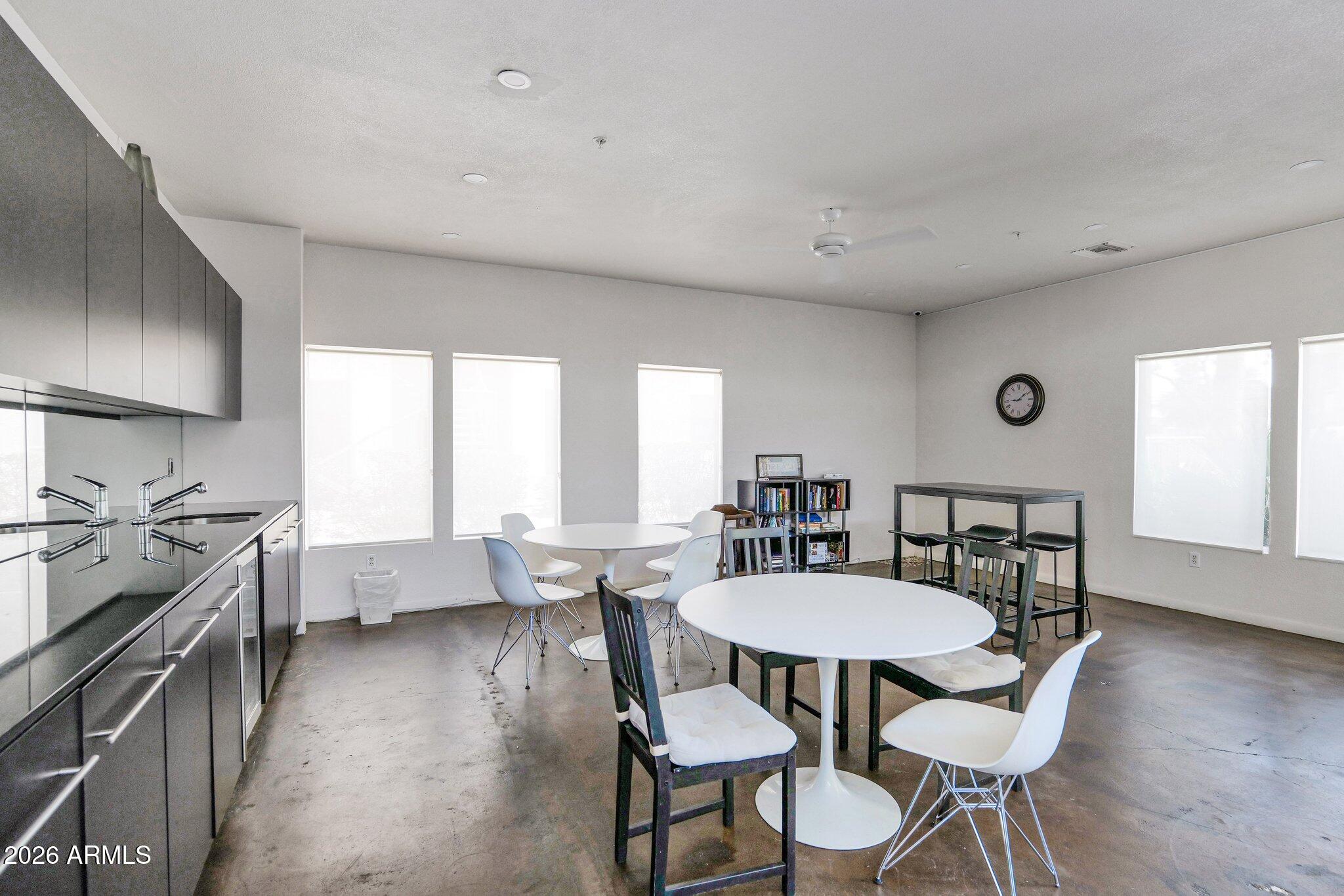 1295 North Ash Street, Unit 624 Gilbert, AZ 85233 - Photo 36 of 39 a view of a dining room with furniture window and wooden floor