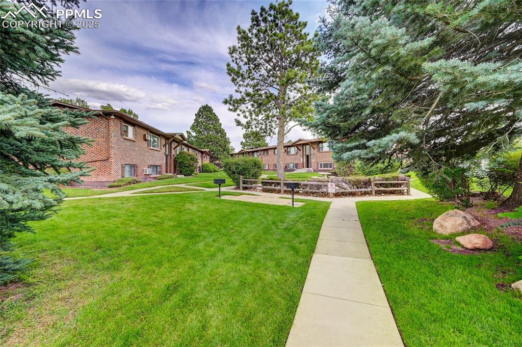 6633 Dublin Loop West, Unit 4 Colorado Springs, CO 80918 - Photo 12 of 33 a view of an outdoor space and a yard