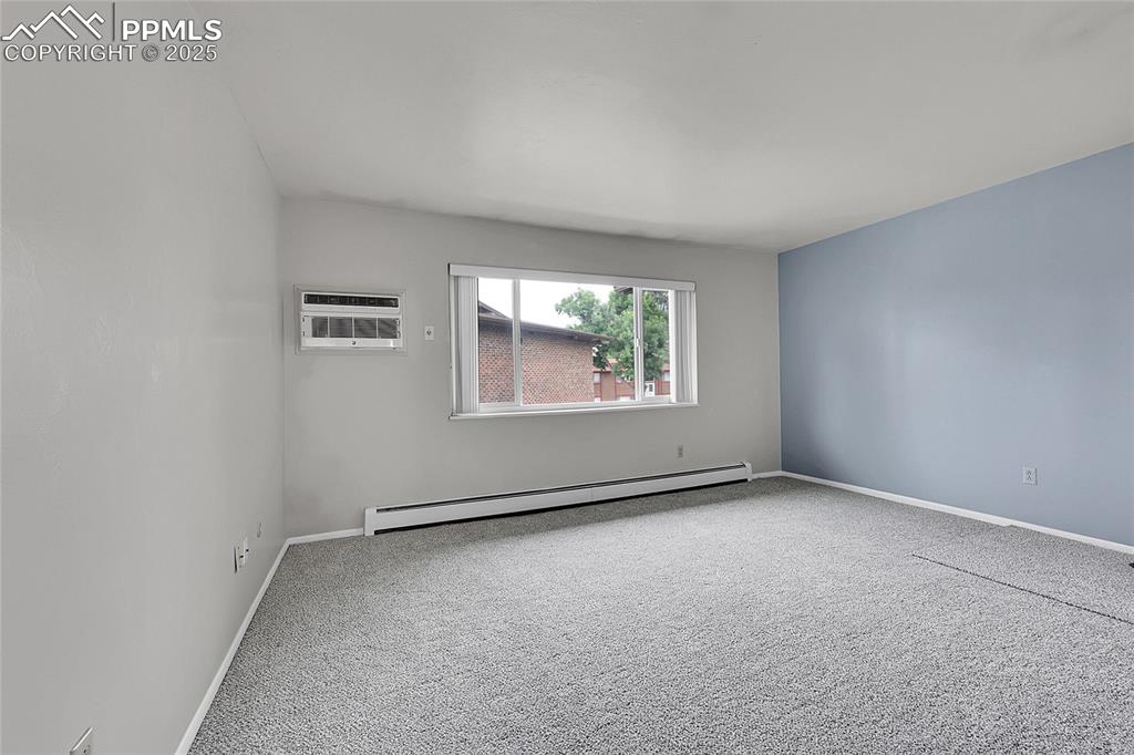 6633 Dublin Loop West, Unit 4 Colorado Springs, CO 80918 - Photo 23 of 33 an empty room with windows