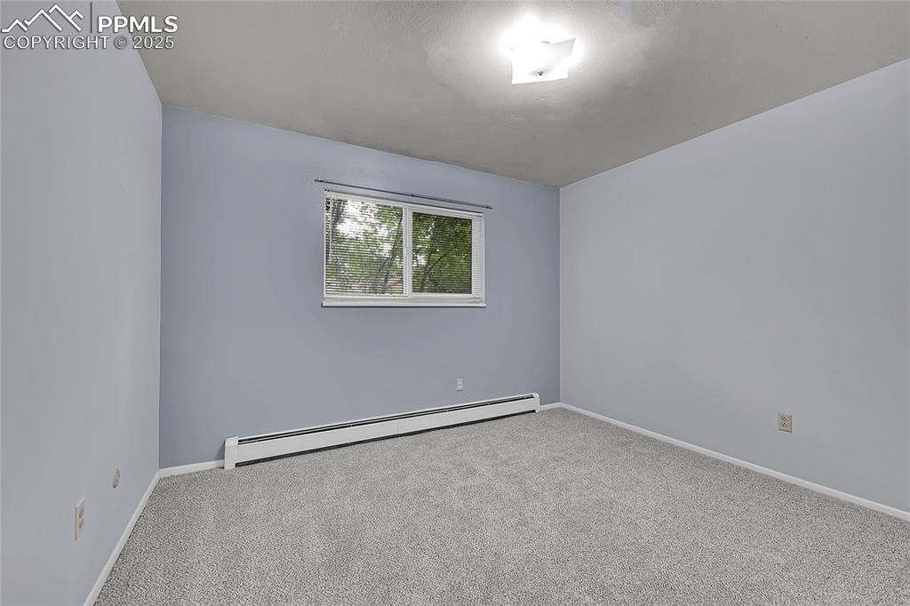 6633 Dublin Loop West, Unit 4 Colorado Springs, CO 80918 - Photo 28 of 33 an empty room with windows