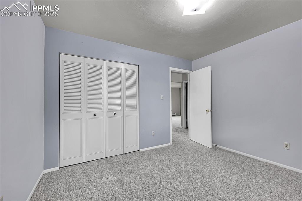 6633 Dublin Loop West, Unit 4 Colorado Springs, CO 80918 - Photo 29 of 33 a view of an empty room and closet area