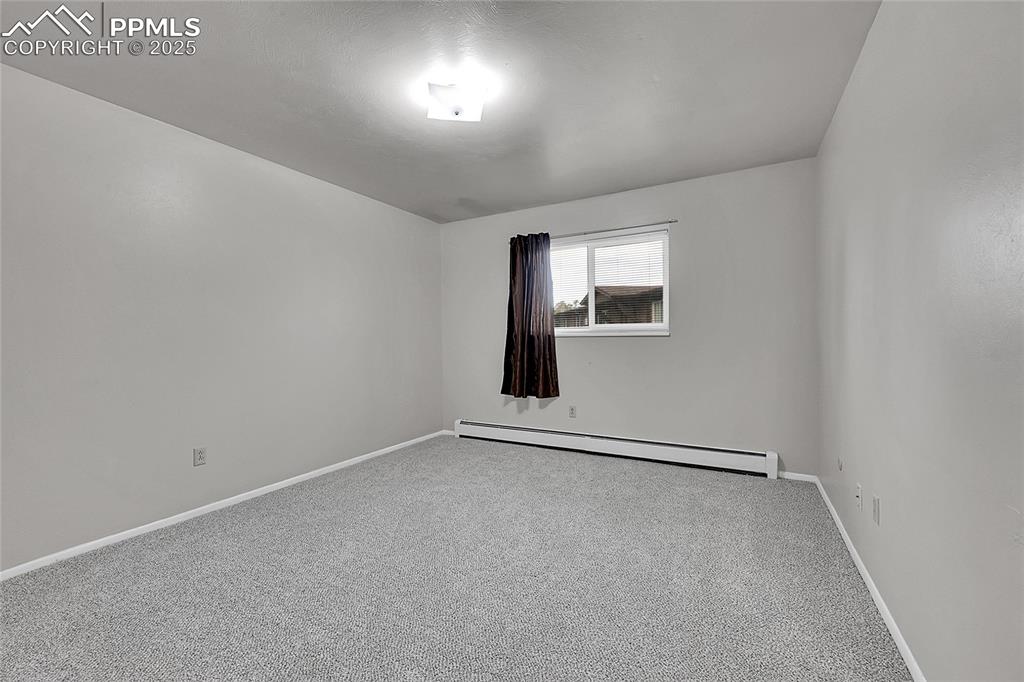 6633 Dublin Loop West, Unit 4 Colorado Springs, CO 80918 - Photo 31 of 33 an empty room with windows