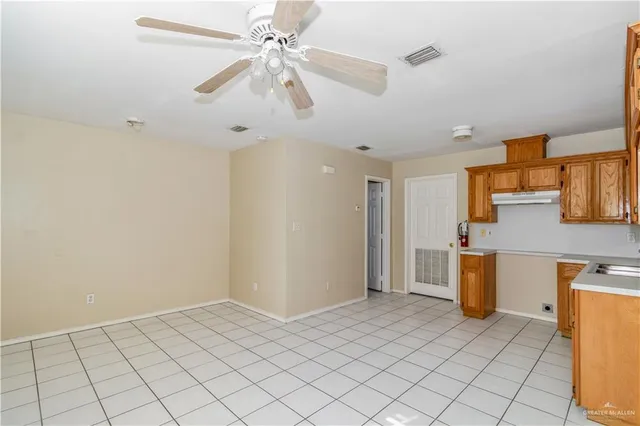 a view of a kitchen with a sink and a microwave