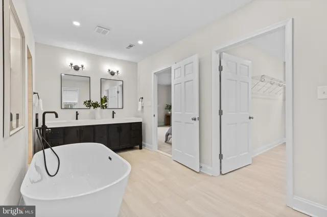 a living room with furniture a fireplace and a floor to ceiling window