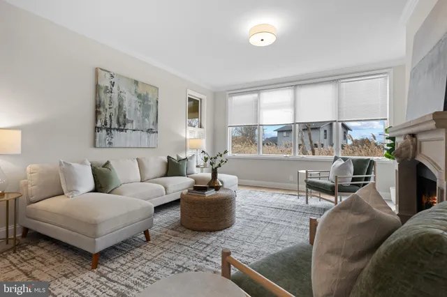 a view of a dining room with furniture large windows and wooden floor