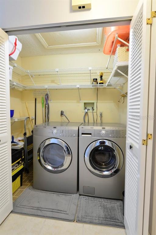 6715 Devonshire Lane, Unit 6715 New Port Richey, FL 34653 - Photo 18 of 38 The laundry closet has great storage room.