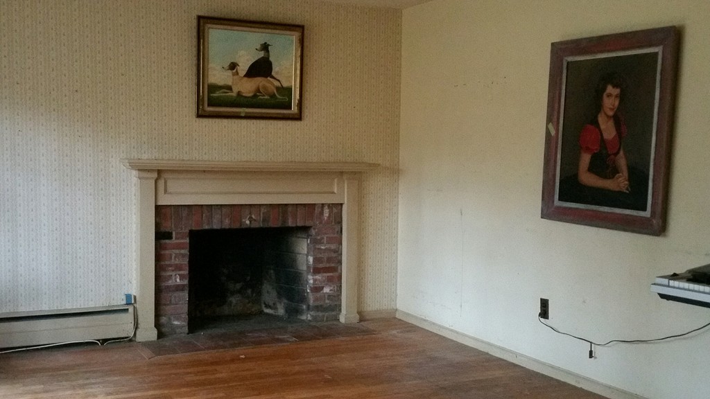 182 Topsfield Road Boxford, MA 01921 - Photo 4 of 8 a living room with painting on the wall and a fireplace