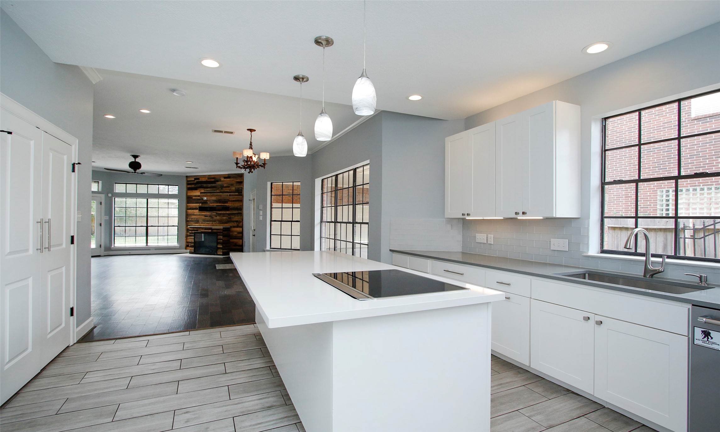 16119 Cochet Spring Drive Spring, TX 77379 - Photo 19 of 26 The electric cooktop is conveniently set on the kitchen island, perfect for efficient cooking.