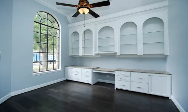 a view of a kitchen with windows and chandelier