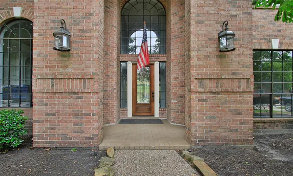 a brick building with a door and a window