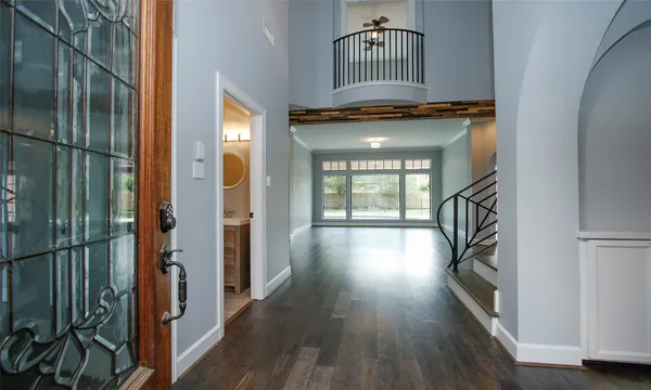 a view of an entryway with wooden floor