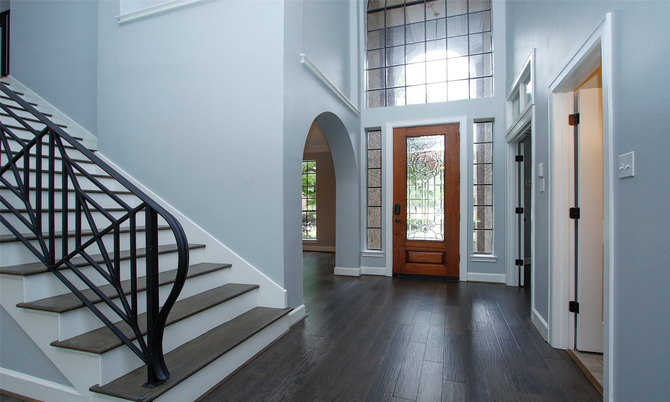 16119 Cochet Spring Drive Spring, TX 77379 - Photo 8 of 26 The first floor features rich dark brown wood flooring; a wide staircase with elegant iron balusters leading to the second floor.