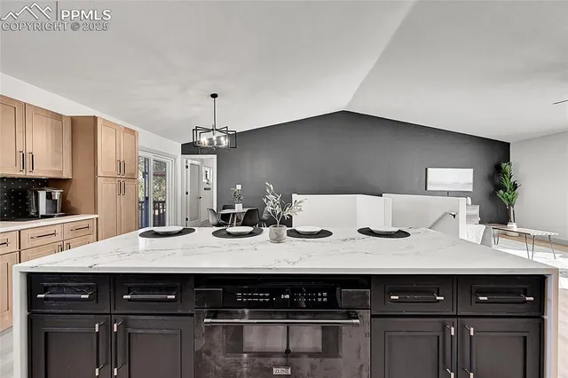 a kitchen with a sink and cabinets