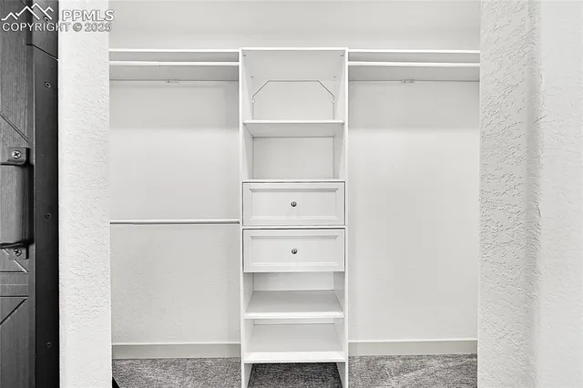 a view of an empty walk in closet