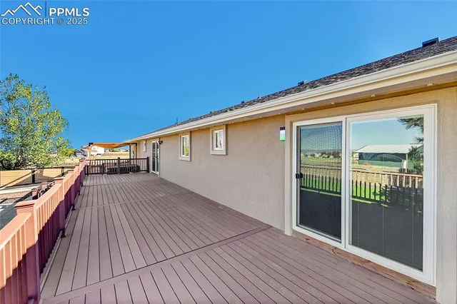 a view of a balcony with wooden floor