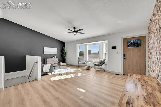 a view of a livingroom with furniture and lounge chair