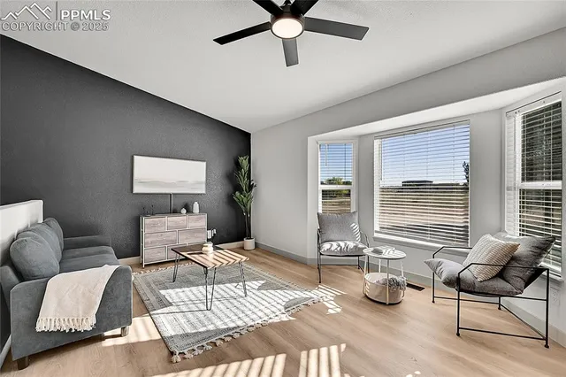 a bedroom with furniture and a window