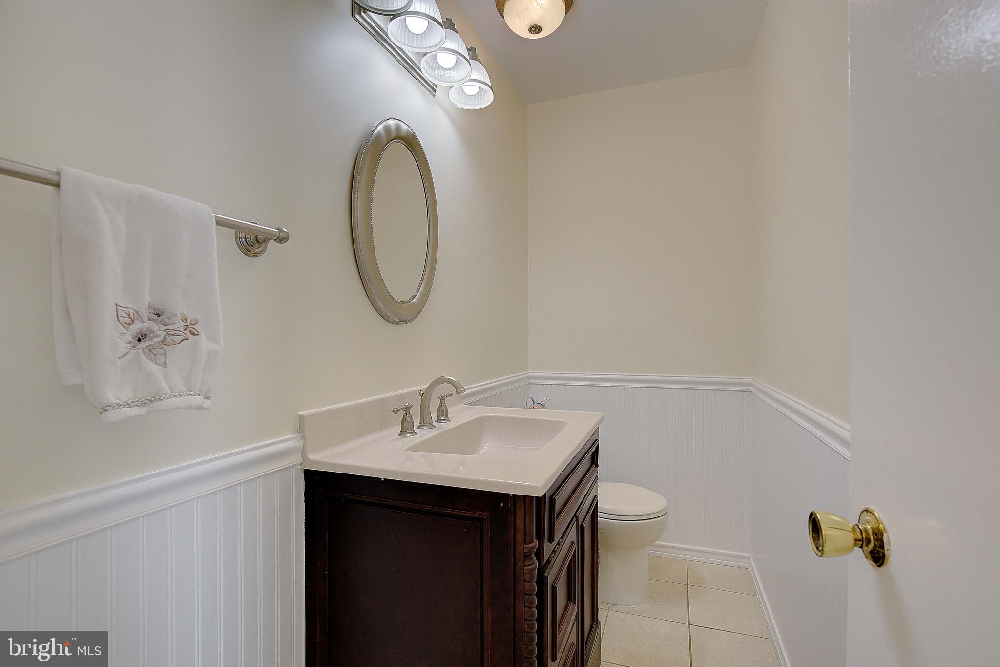 12702 Cedarbrook Lane Laurel, MD 20708 - Photo 16 of 43 a bathroom with a sink and a mirror