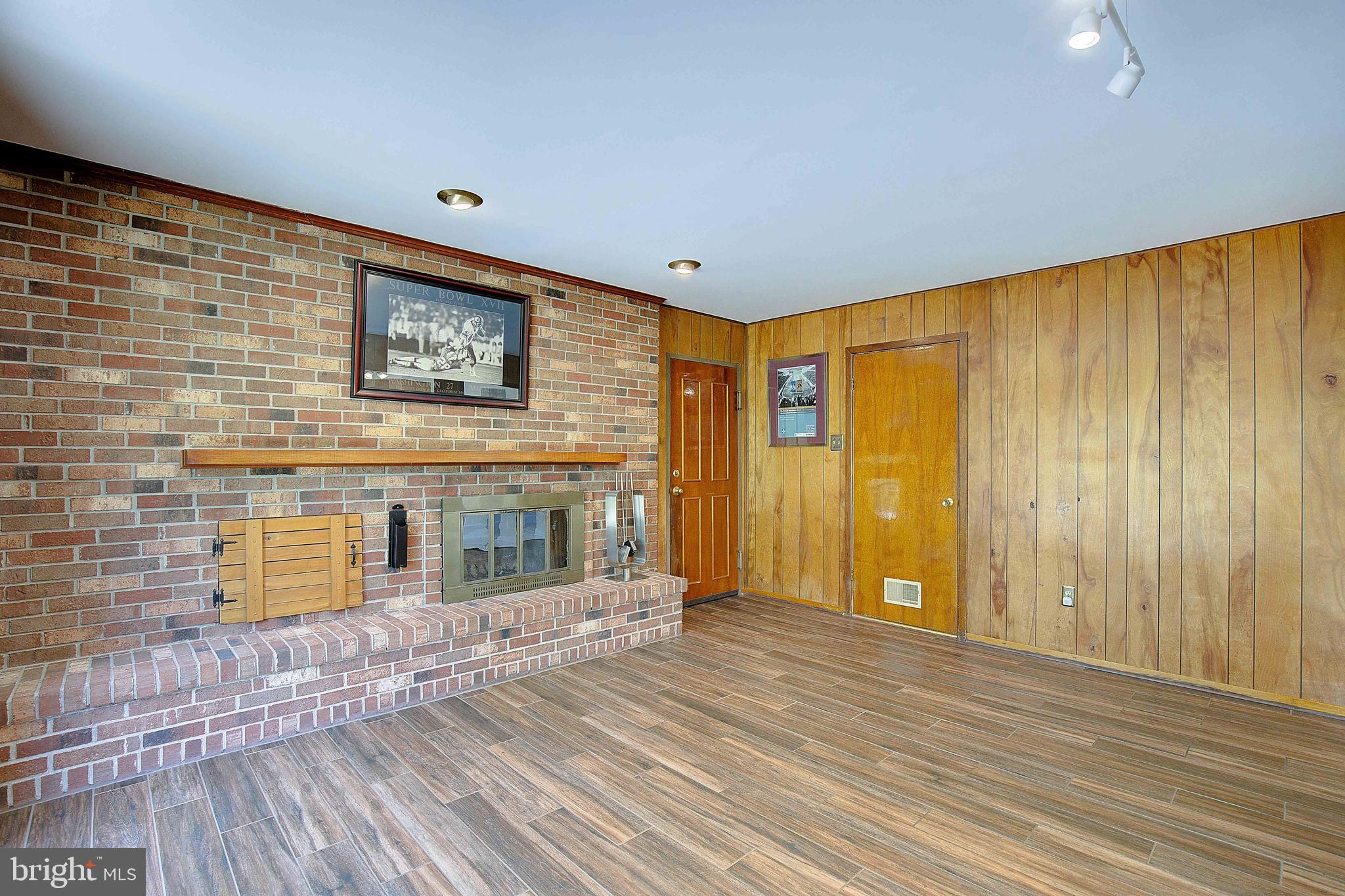 12702 Cedarbrook Lane Laurel, MD 20708 - Photo 19 of 43 a view of a hallway with wooden floor
