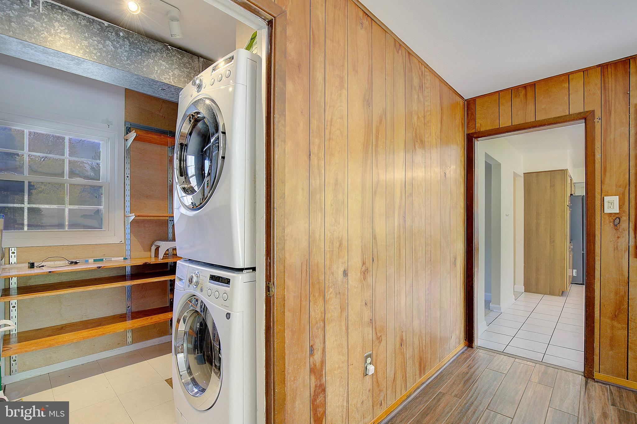 12702 Cedarbrook Lane Laurel, MD 20708 - Photo 20 of 43 a view of walk in closet with clothes and shoes
