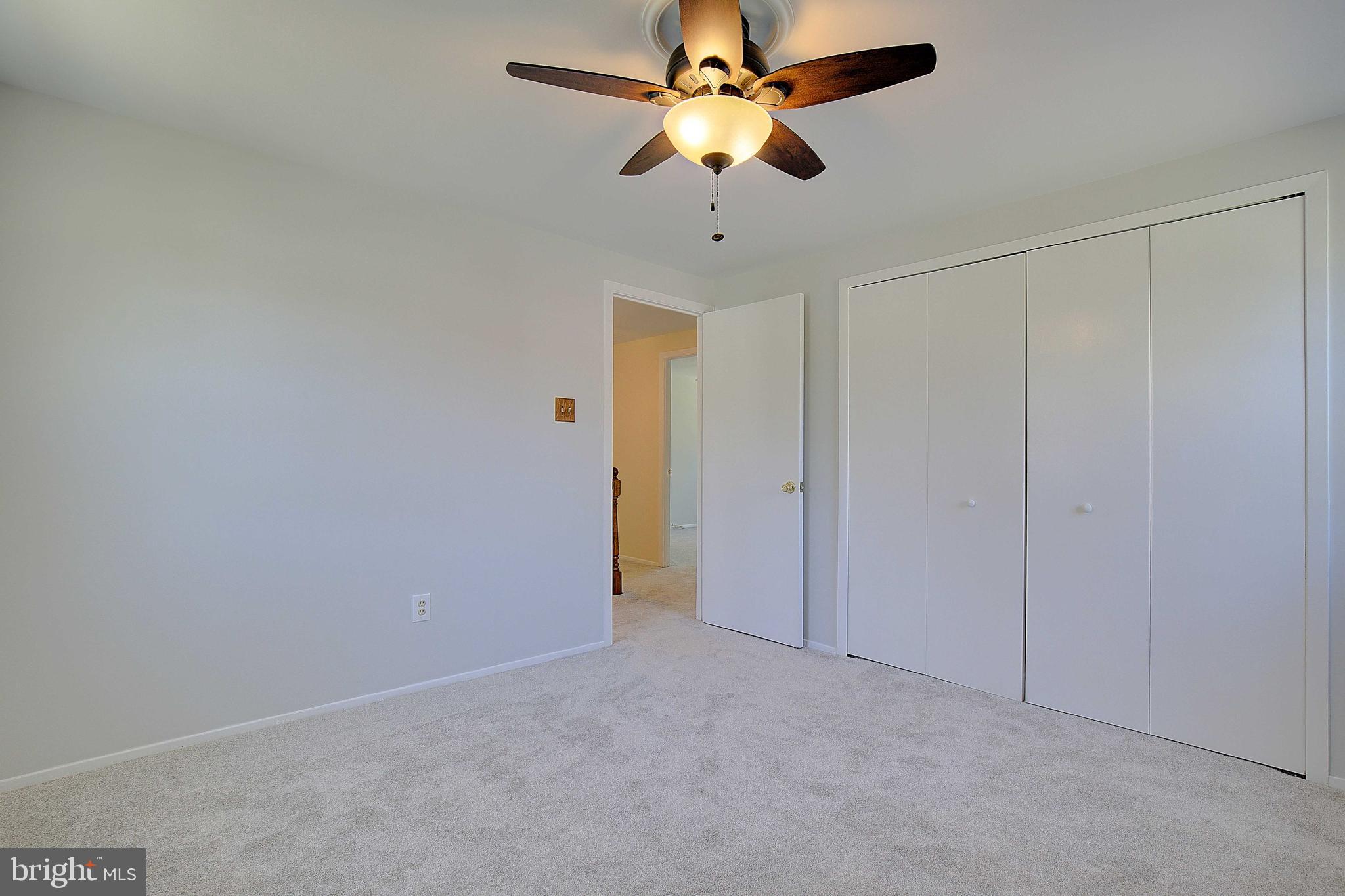 12702 Cedarbrook Lane Laurel, MD 20708 - Photo 22 of 43 a view of a chandelier fan in a room