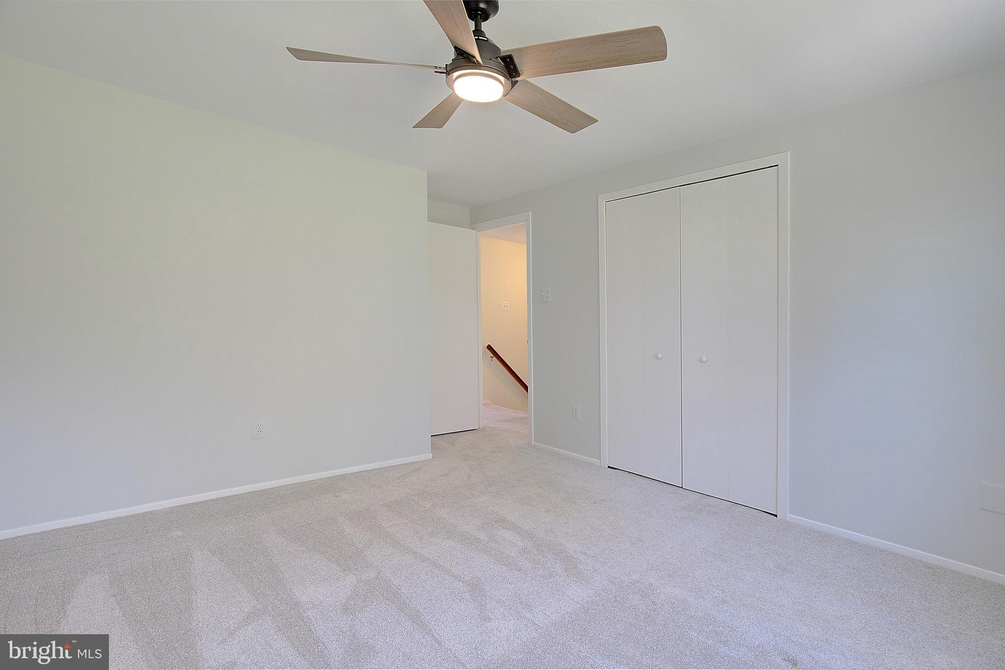 12702 Cedarbrook Lane Laurel, MD 20708 - Photo 25 of 43 an empty room with a fan & a window