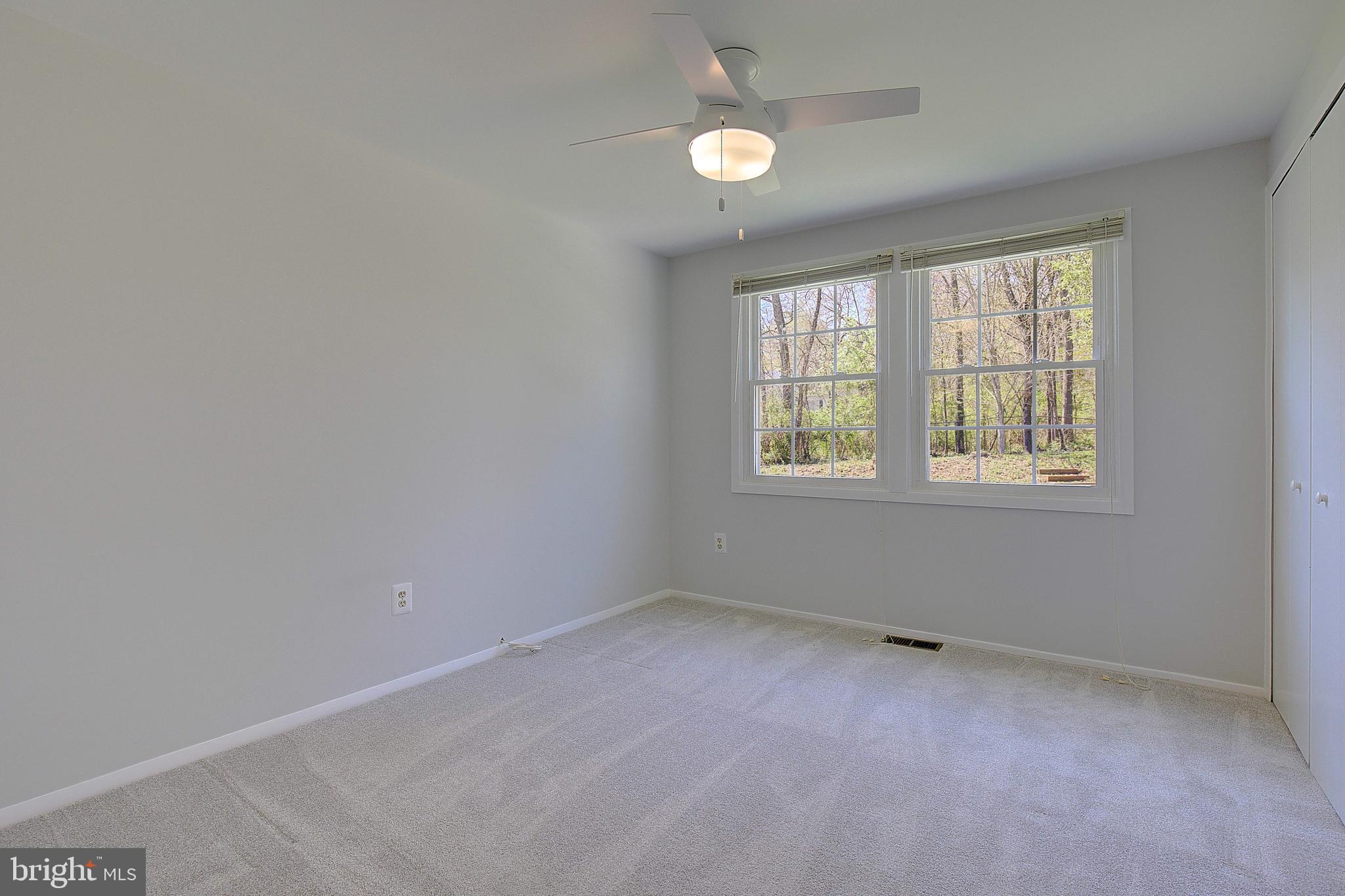 12702 Cedarbrook Lane Laurel, MD 20708 - Photo 26 of 43 an empty room with windows
