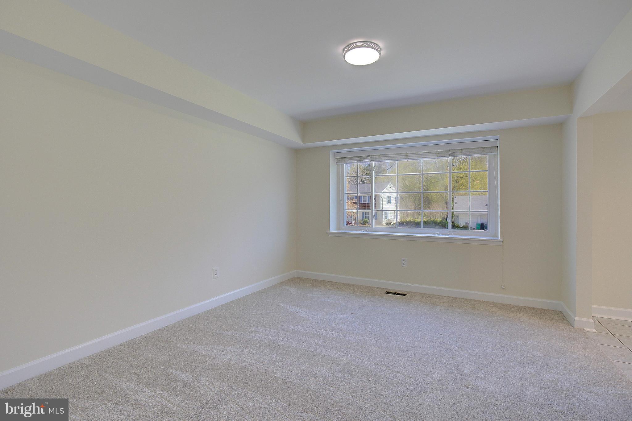 12702 Cedarbrook Lane Laurel, MD 20708 - Photo 28 of 43 an empty room with a window