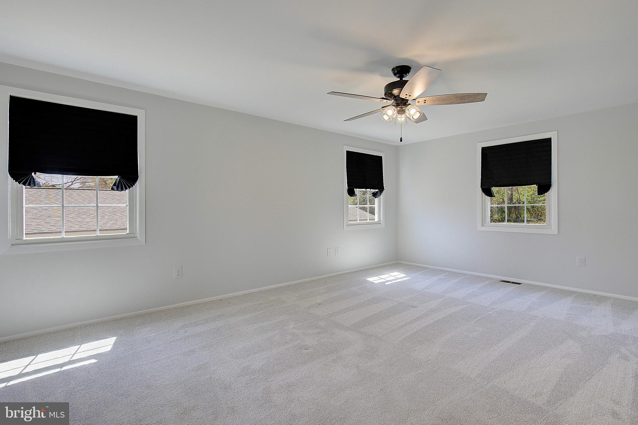 12702 Cedarbrook Lane Laurel, MD 20708 - Photo 29 of 43 a view of a livingroom with a flat screen tv