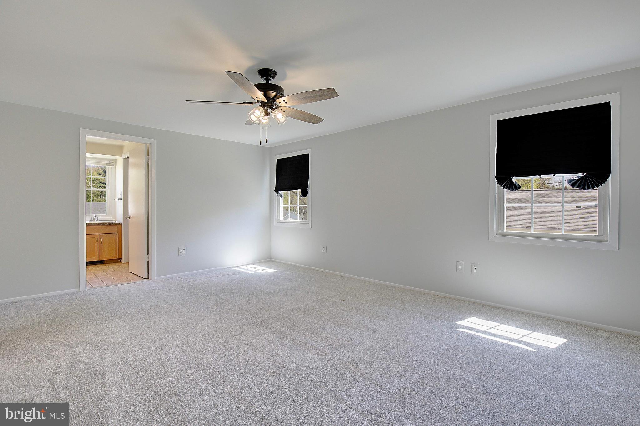 12702 Cedarbrook Lane Laurel, MD 20708 - Photo 30 of 43 a view of a livingroom with a flat screen tv