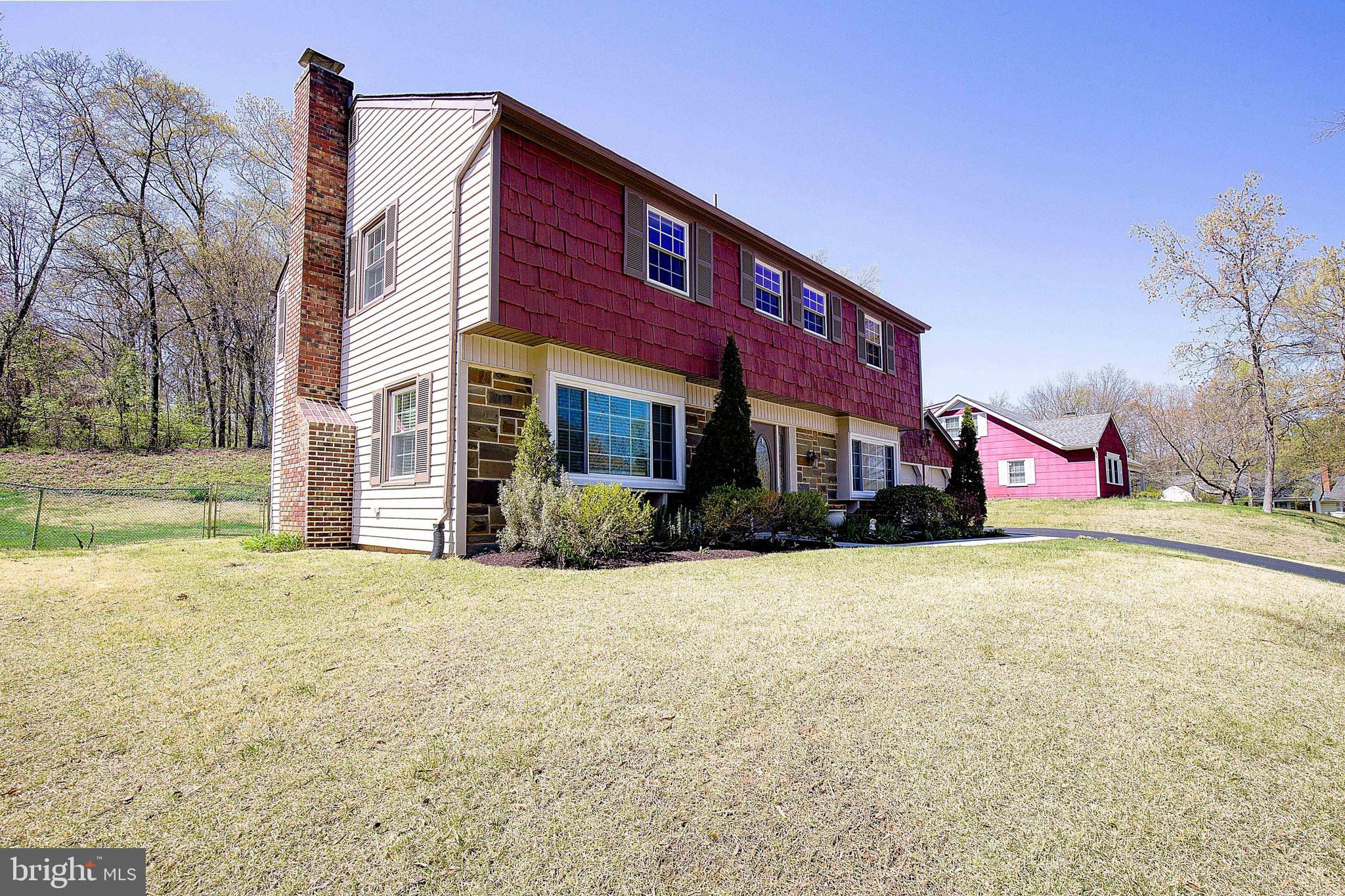 12702 Cedarbrook Lane Laurel, MD 20708 - Photo 3 of 43 a view of a house with a yard
