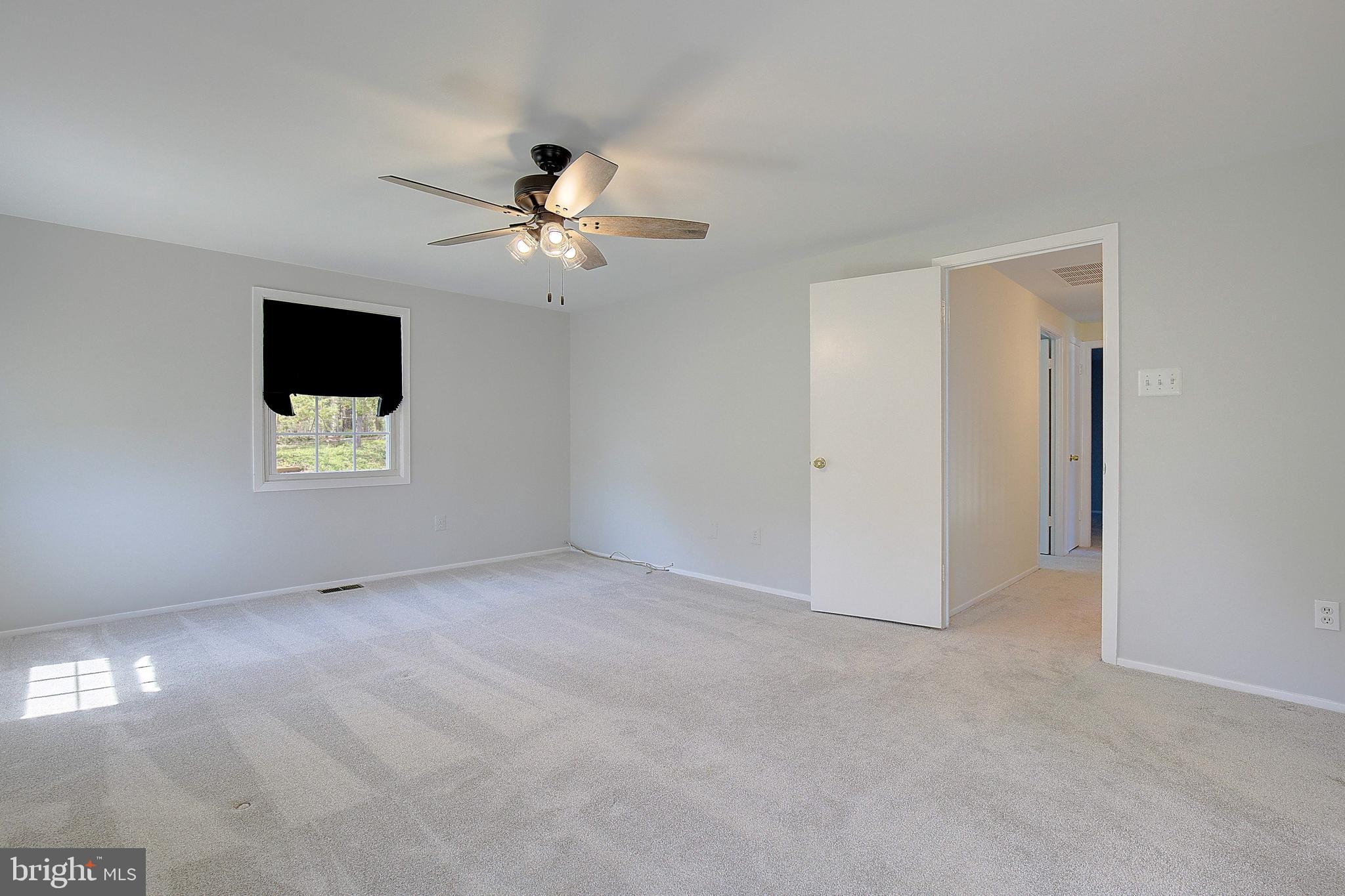 12702 Cedarbrook Lane Laurel, MD 20708 - Photo 32 of 43 a view of an empty room with a window