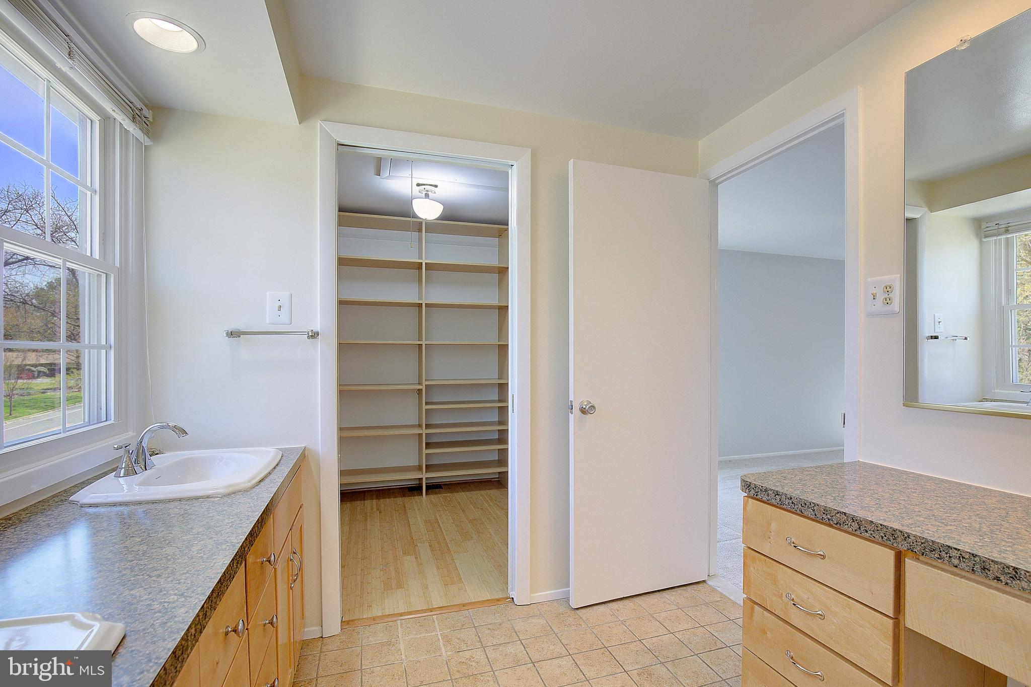 12702 Cedarbrook Lane Laurel, MD 20708 - Photo 35 of 43 a bathroom with a granite countertop sink and a mirror