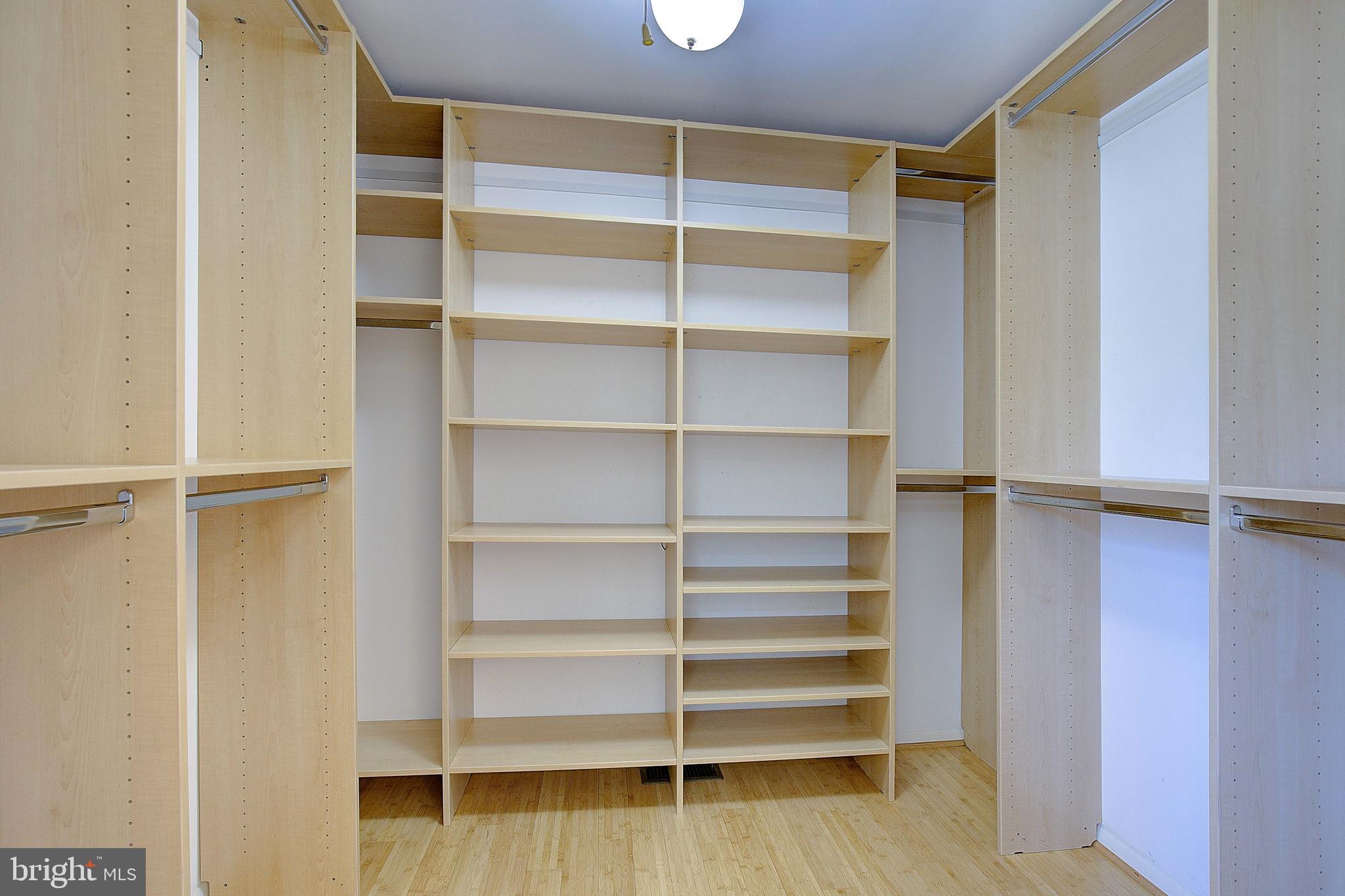 12702 Cedarbrook Lane Laurel, MD 20708 - Photo 37 of 43 a view of walk in closet with empty racks