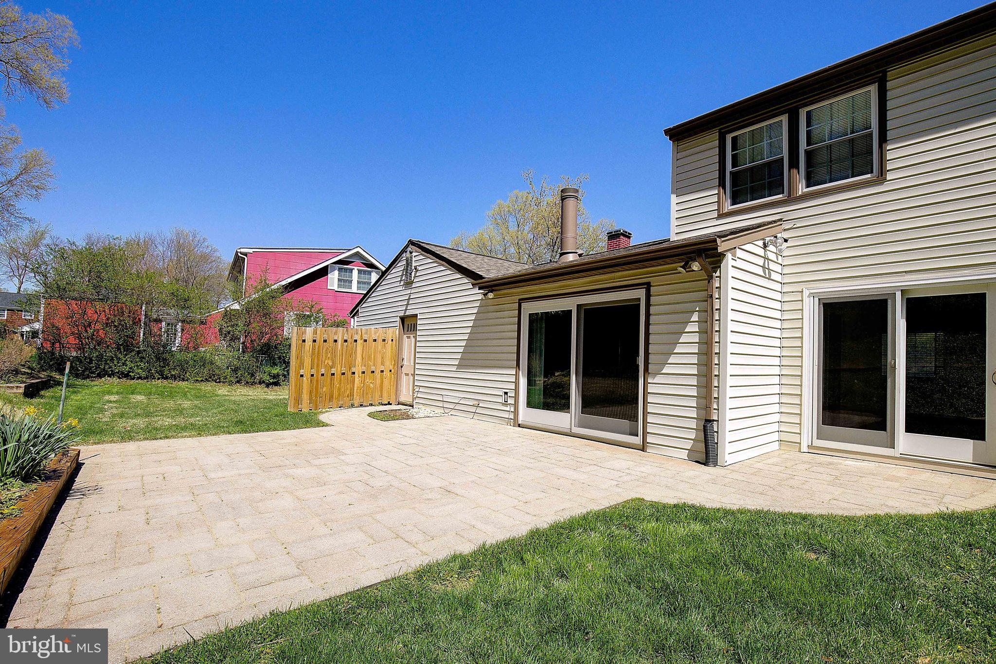 12702 Cedarbrook Lane Laurel, MD 20708 - Photo 40 of 43 a view of a house with yard and a garden