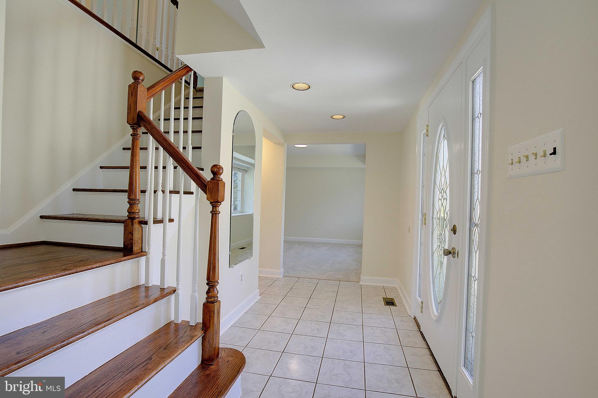 12702 Cedarbrook Lane Laurel, MD 20708 - Photo 4 of 43 a view of an entryway with wooden floor