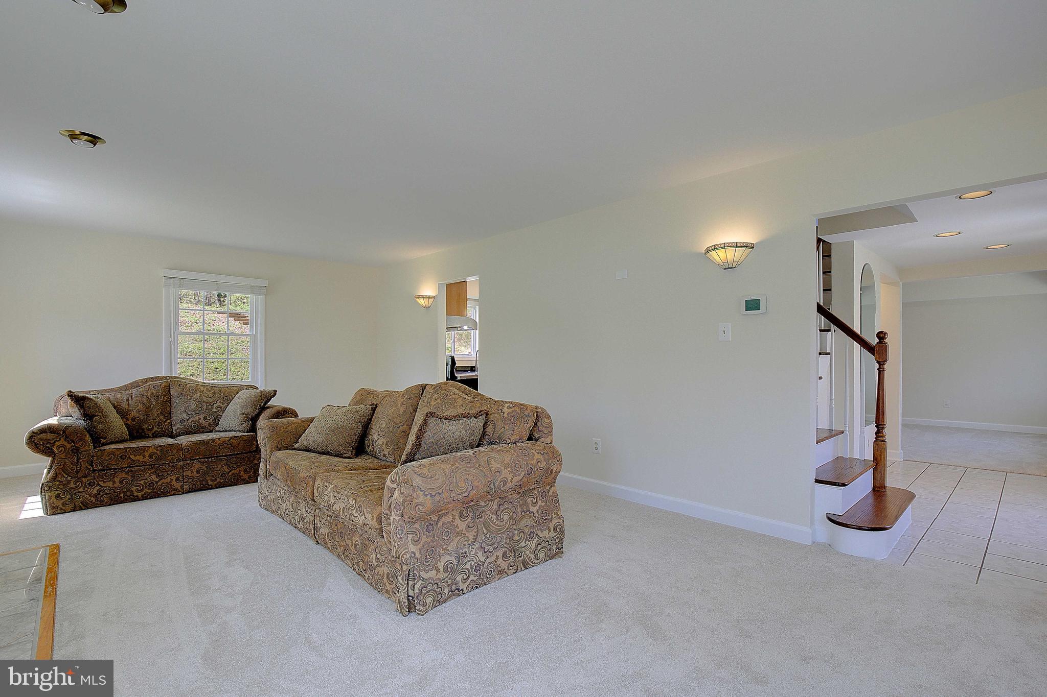 12702 Cedarbrook Lane Laurel, MD 20708 - Photo 7 of 43 a living room with furniture and a couch