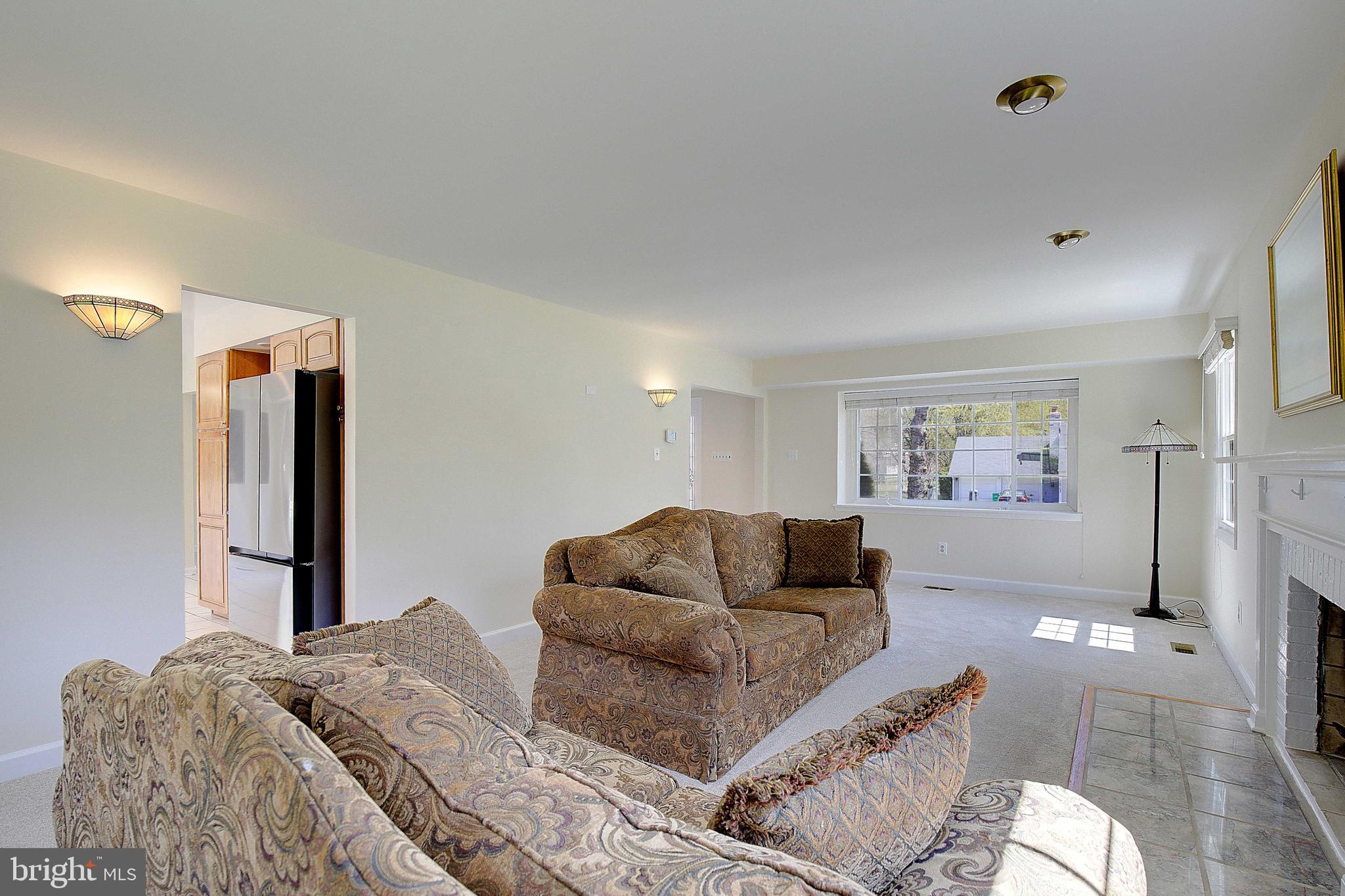 12702 Cedarbrook Lane Laurel, MD 20708 - Photo 9 of 43 a living room with furniture and a couch