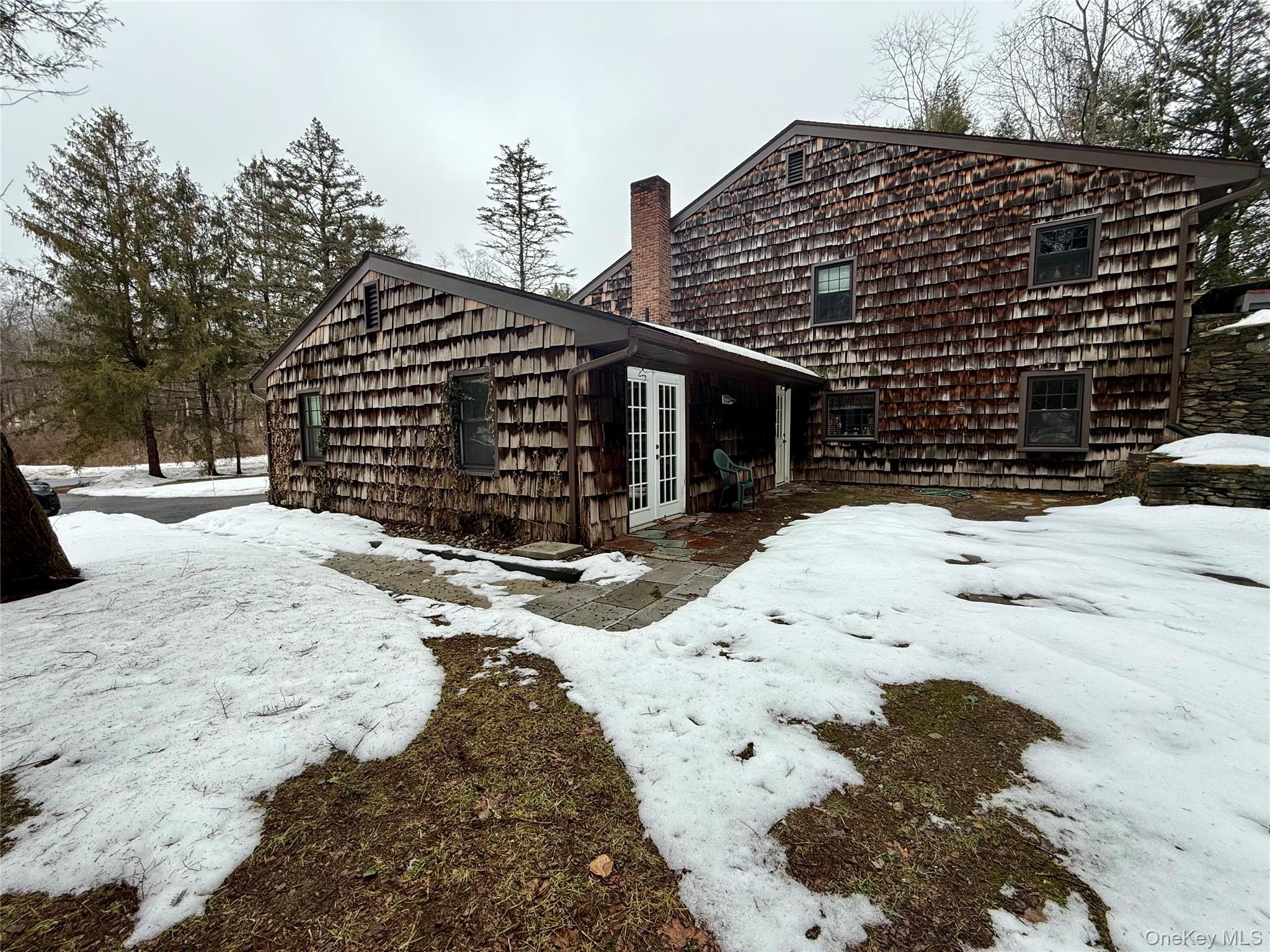 102 Fallkill Road, Unit 1W Hyde Park, NY 12538 - Photo 20 of 21 a view of a house with snow on the road