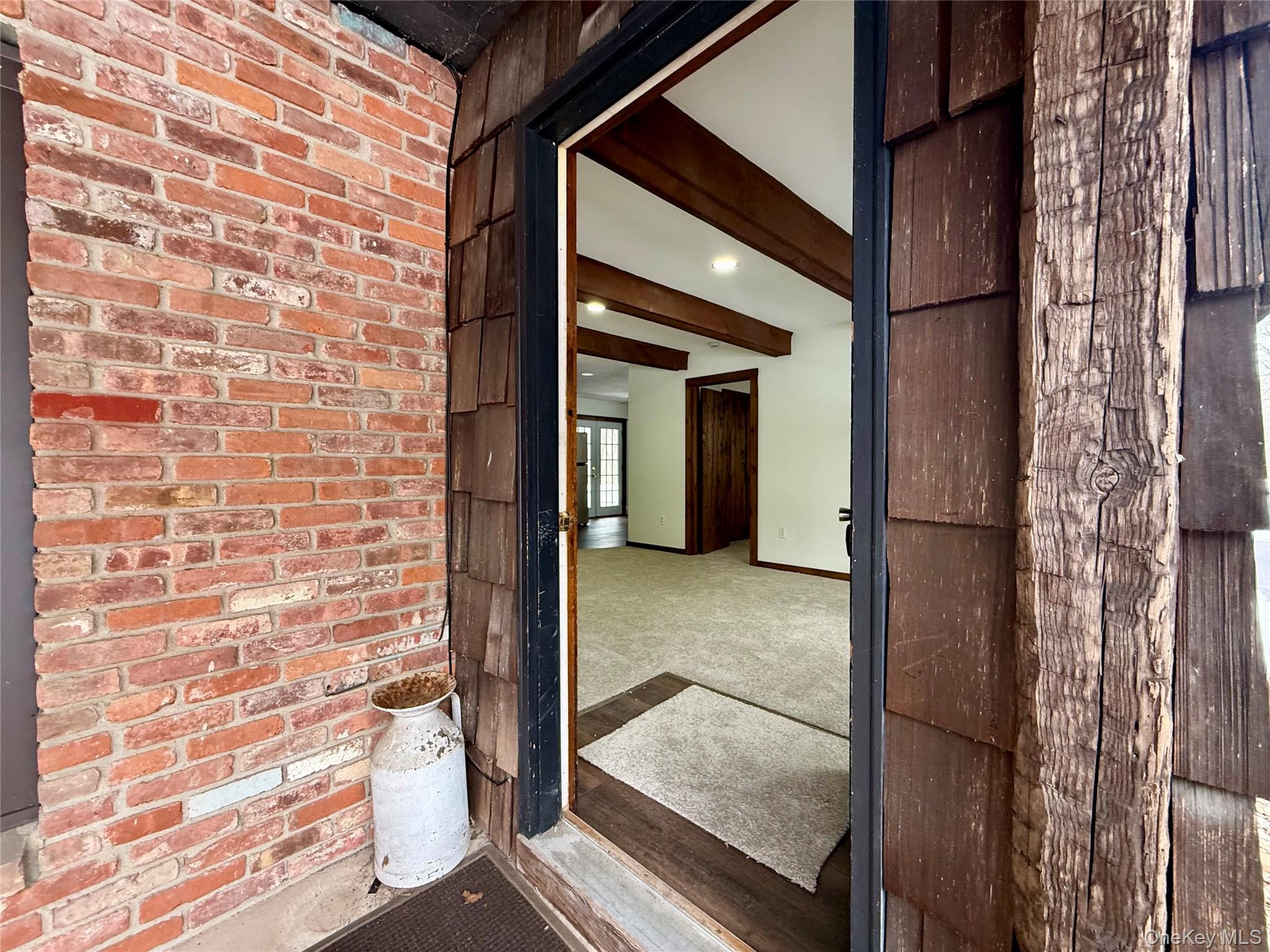 102 Fallkill Road, Unit 1W Hyde Park, NY 12538 - Photo 3 of 21 a view of a door and a window