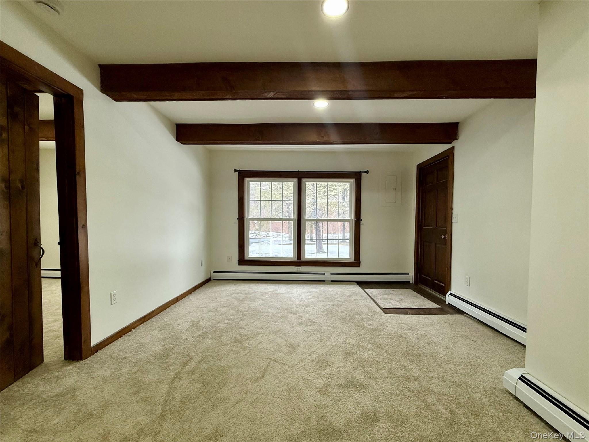 102 Fallkill Road, Unit 1W Hyde Park, NY 12538 - Photo 6 of 21 a view of an empty room with a window