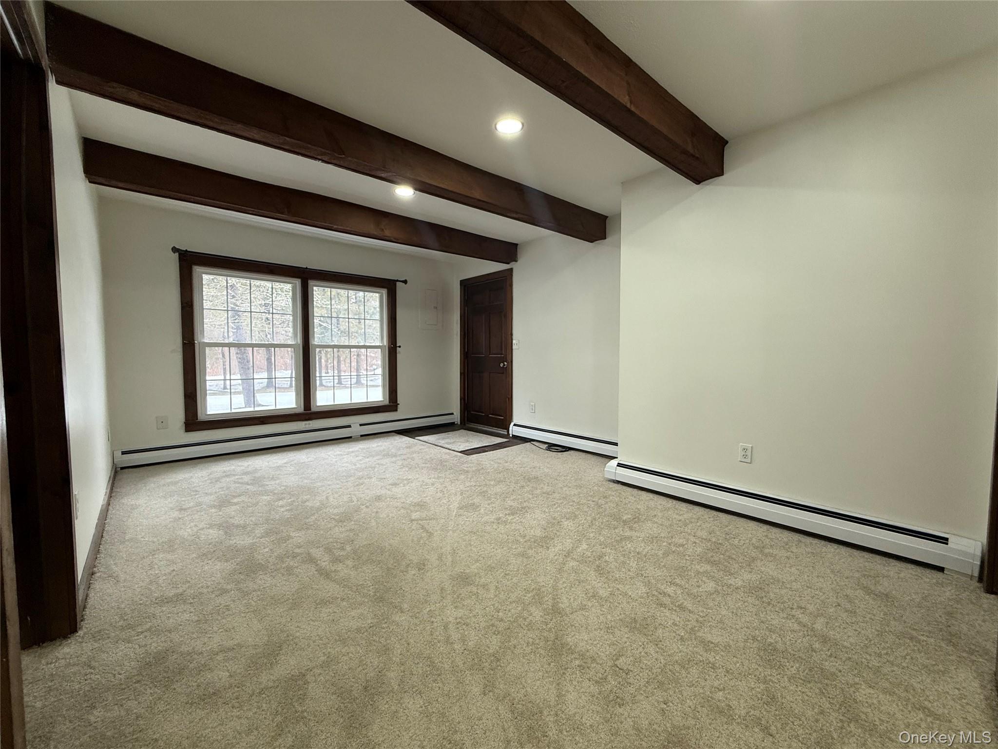 102 Fallkill Road, Unit 1W Hyde Park, NY 12538 - Photo 7 of 21 a view of an empty room with a window