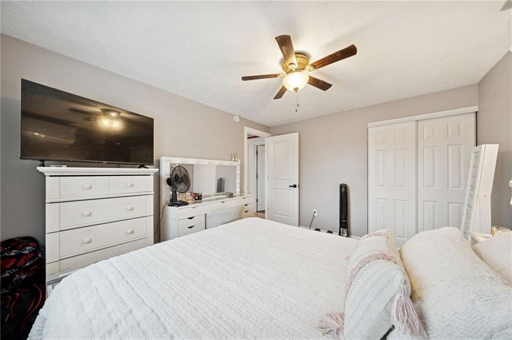 440 Lippencott Run Road Waynesburg, PA 15370 - Photo 11 of 39 a bedroom with a bed and a flat screen tv